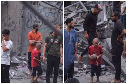 Snimak fotografa iz Gaze ne ostavlja nikoga ravnodušnim: Pogledajte šta je dječak našao u ruševinama (VIDEO)