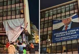 VIDEO Ljudi skinuli golemog Šešelja sa zgrade u Novom Sadu
